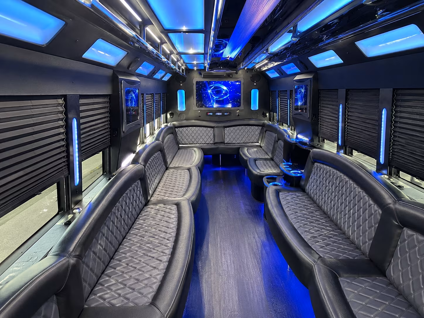 Friends laughing during a party bus celebration in Fort Lauderdale
